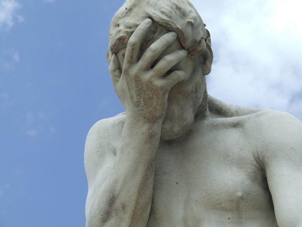 Statue facepalming in frustration
